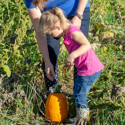 Mom and Daugther Picking a Pumpkin at Garver Family Farm