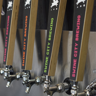 Swine City tap handles