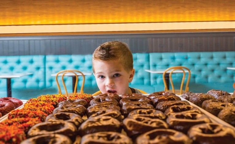 Boy Looking at Donuts