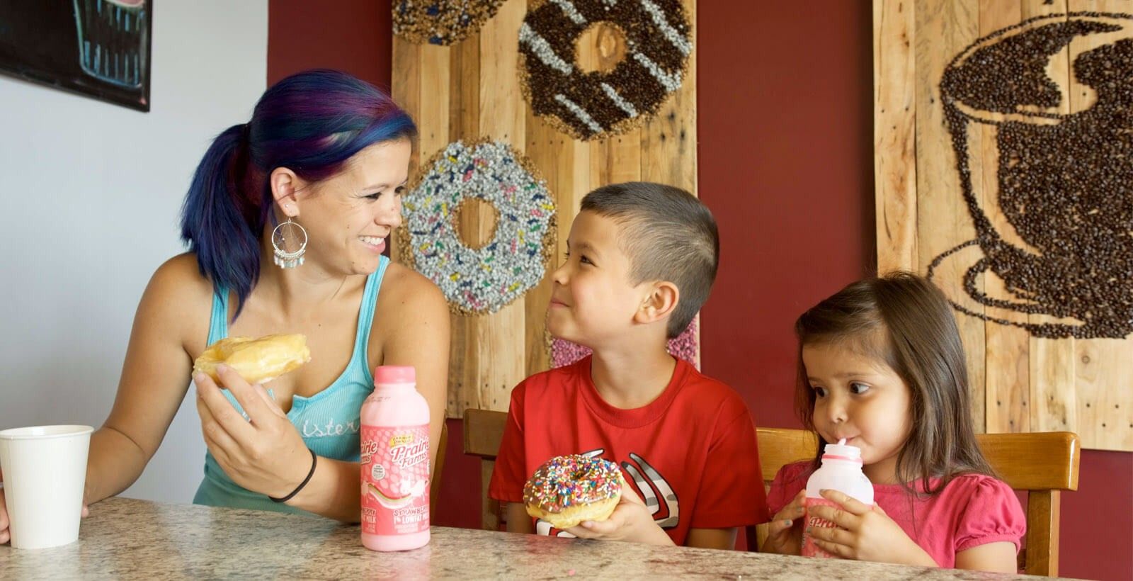 Mom and Two Kids Enjoy Donuts